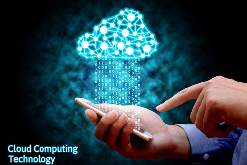 Close-up of a man’s hands holding an iPhone with image graphics forming a blue, data-like cloud above the phone.