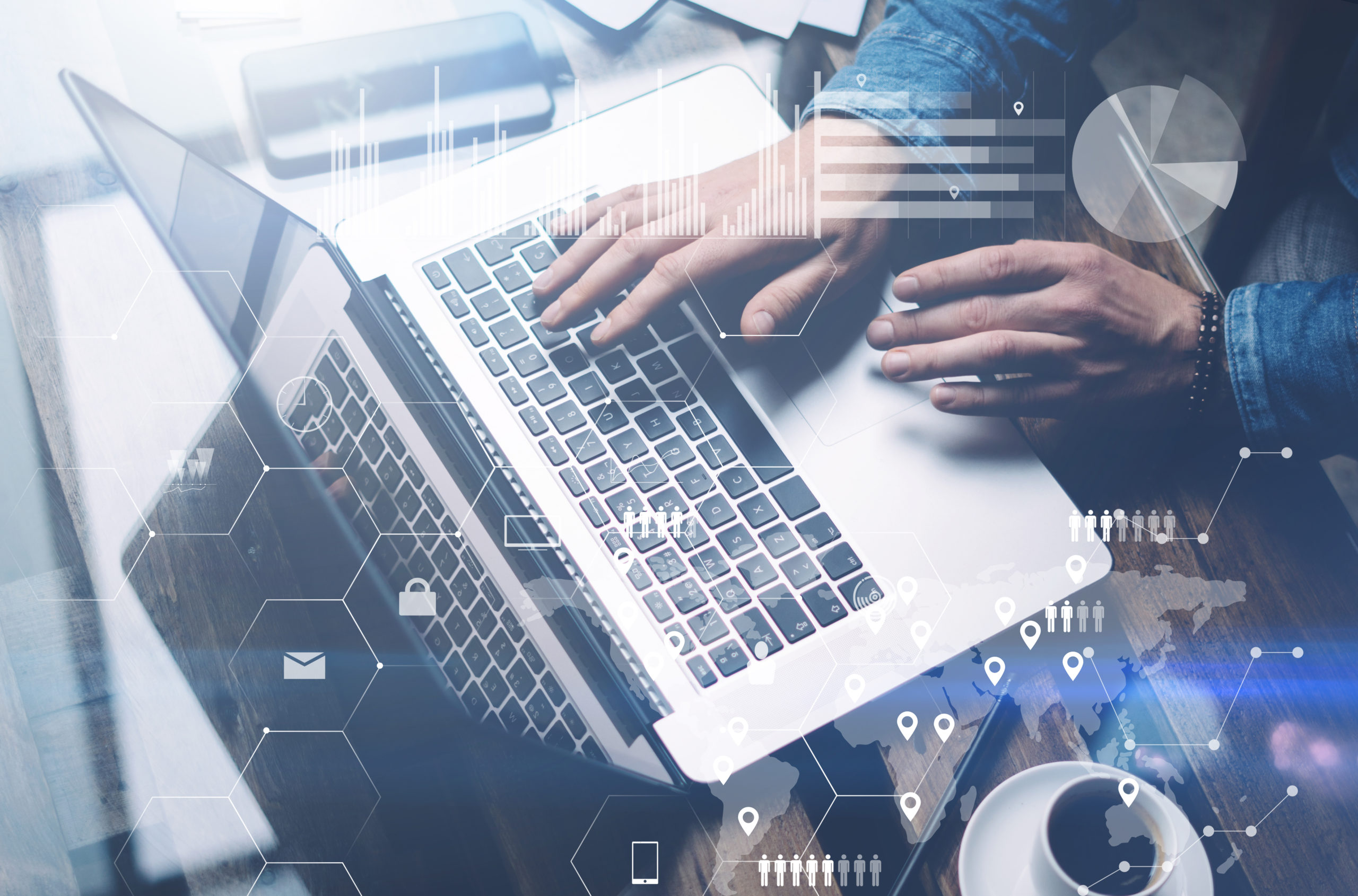 Man sits at desk, coffee cup nearby, typing on laptop computer, overlaid with digital icons suggesting cyber risk management.